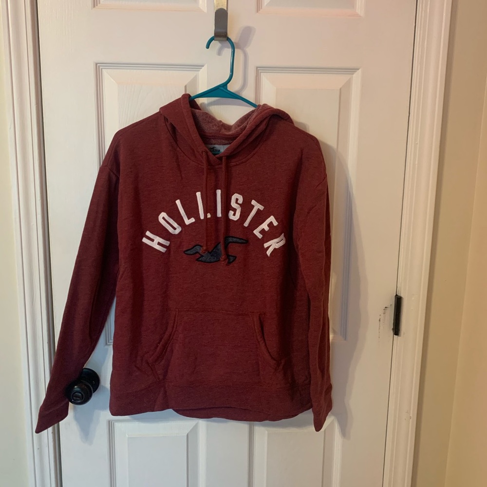 A maroon fleece lined Hollister hoodie